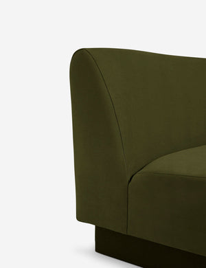 Close-up of the gray velvet fabric and the connectors on the base of the gray velvet sectional sofa