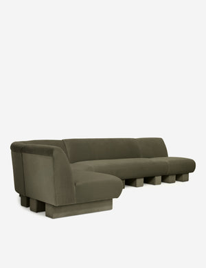 Angled view of the Lena left-facing gray velvet sectional sofa with upholstered beam legs.