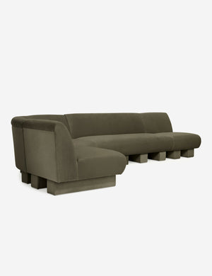 Angled view of the Lena left-facing gray velvet sectional sofa with upholstered beam legs.