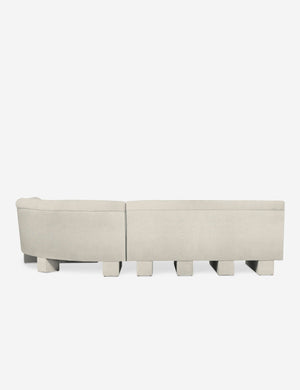 Rear view of the entire Lena left-facing white boucle sectional sofa with upholstered beam legs.