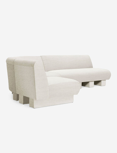 #color::Natural-Linen #configuration::left-facing #size::114-W | Angled view of the Lena left-facing natural linen sectional sofa with upholstered beam legs.