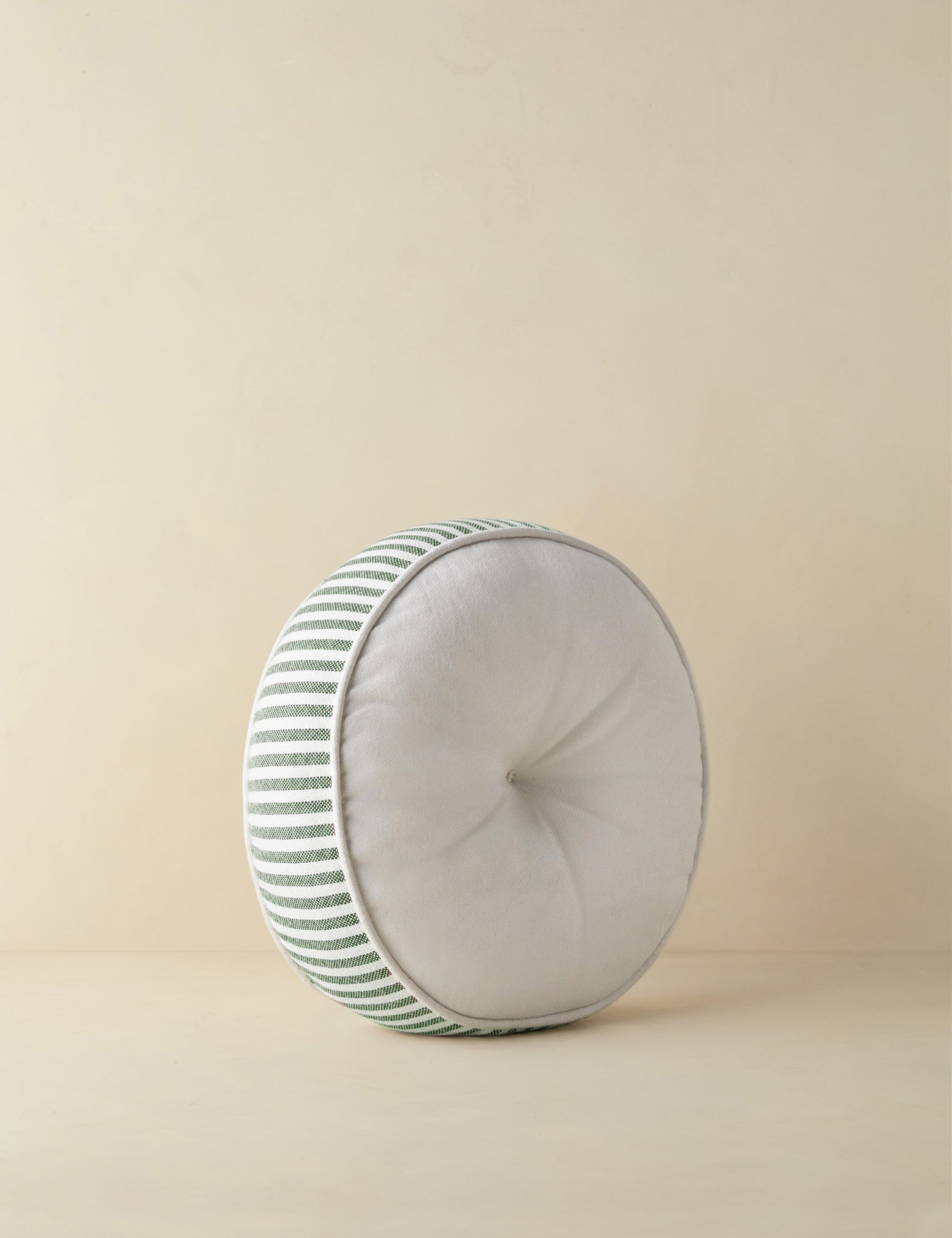 #color::moss | Angled view of the Littu Indoor / Outdoor Striped Disc Pillow by Sarah Sherman Samuel in Moss