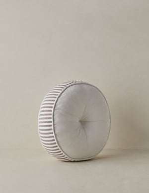 Angled view of the Littu Indoor / Outdoor Striped Disc Pillow by Sarah Sherman Samuel in Brown