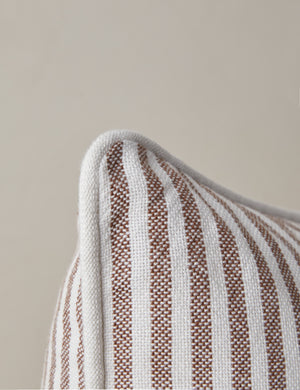 Close up of the corner of the Littu Indoor / Outdoor Striped Throw Pillow by Sarah Sherman Samuel in Brown