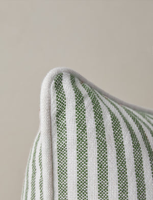 Close up of the corner of the Littu Indoor / Outdoor Striped Throw Pillow by Sarah Sherman Samuel in Moss