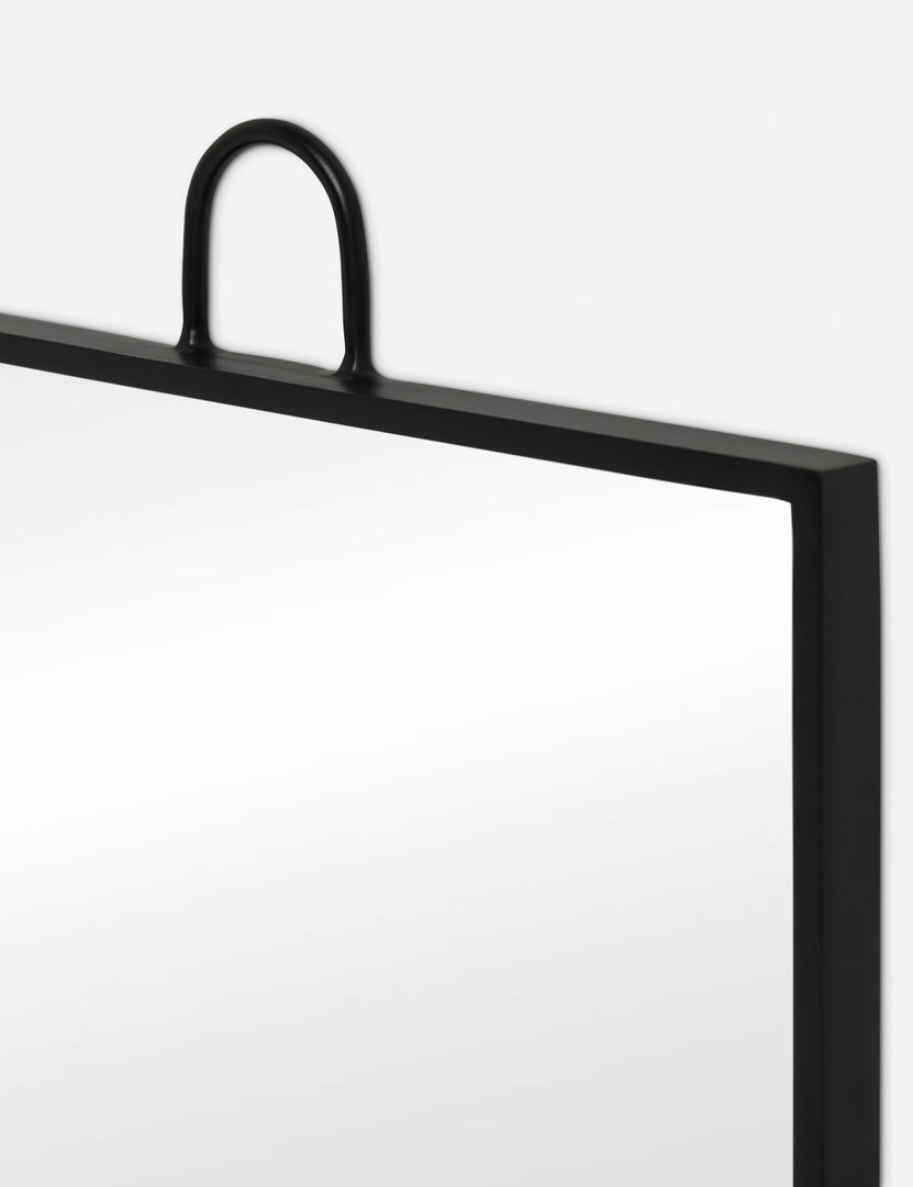 #color::black | Close up view of the corner of the Loop hanging square wall mirror