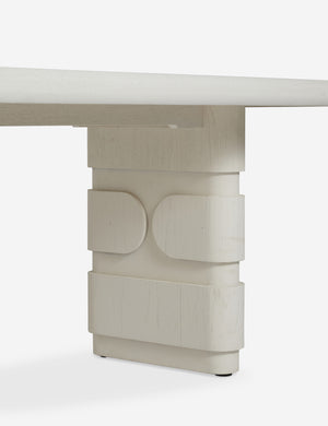 Close up of the leg of the Lowen double pedestal base white washed dining table.