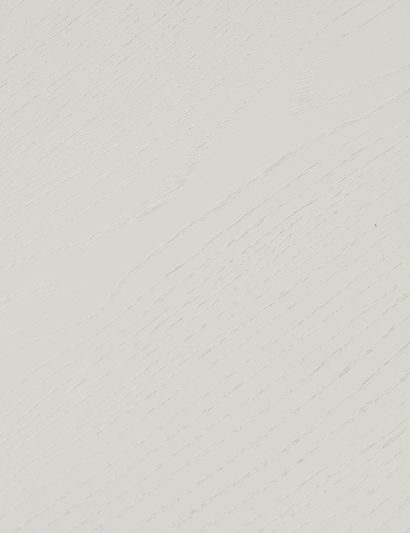 #color::white-wash | Close up of the finish of the Lowen double pedestal base white washed dining table.