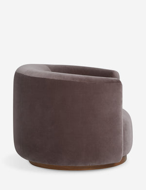 Side profile of the Lowry rounded silhouette velvet accent chair.