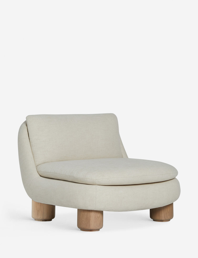 #color::ivory | Angled view of the Lozano chunky low-profile armless accent chair.