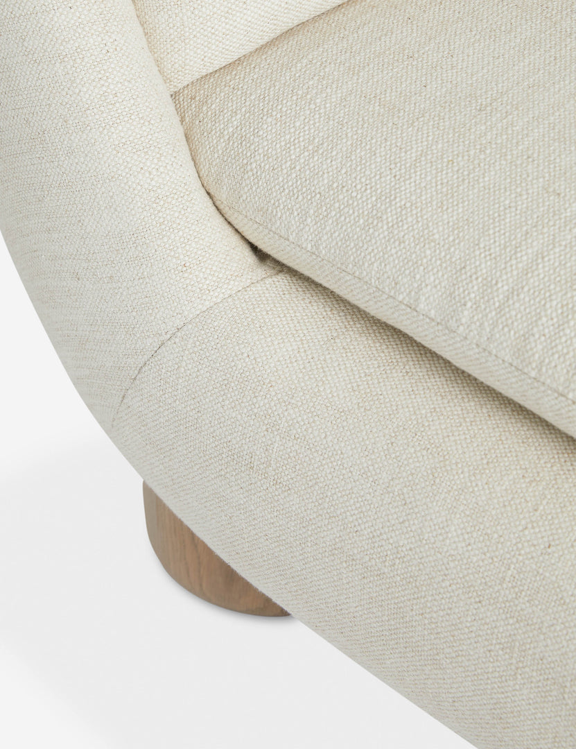 #color::ivory | Close up of the Lozano chunky low-profile armless accent chair.