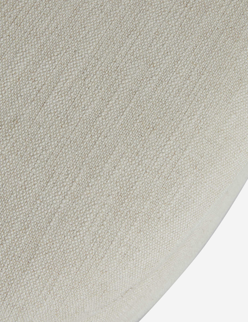 #color::ivory | Close up of the Lozano chunky low-profile armless accent chair.