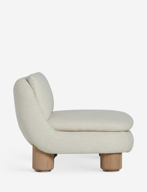 Side profile of the Lozano chunky low-profile armless accent chair.