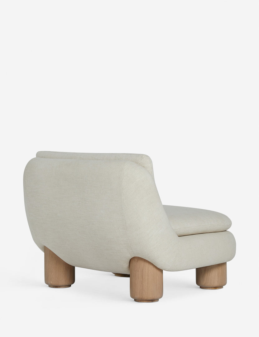 #color::ivory | Angled back view of the Lozano chunky low-profile armless accent chair.