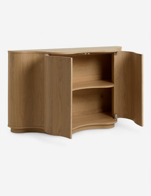 Cora half-moon, wavy light-wood sideboard with doors open