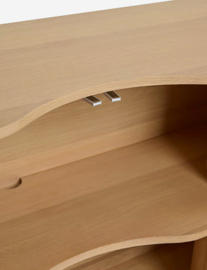 Close up of the Cora half-moon, wavy light-wood sideboard