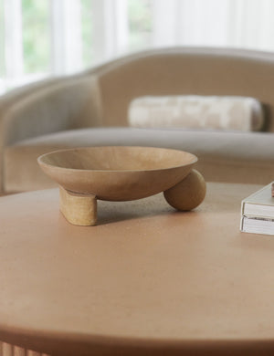 Kester sculptural footed decorative bowl styled on a coffee table.
