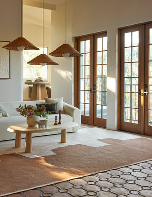 Butte Flatweave Linen Rug by Elan Byrd styled with rattan pendant lights.