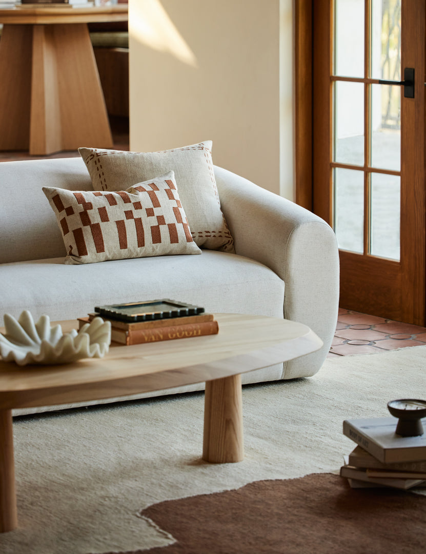 #style::lumbar | Mosaic Linen Lumbar Pillow by Elan Byrd styled on a sofa.
