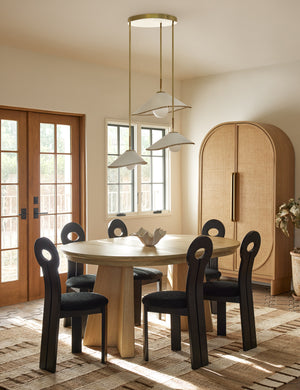 Arroyo Mixed-Material Chandelier by Elan Byrd hanging above a dining table.