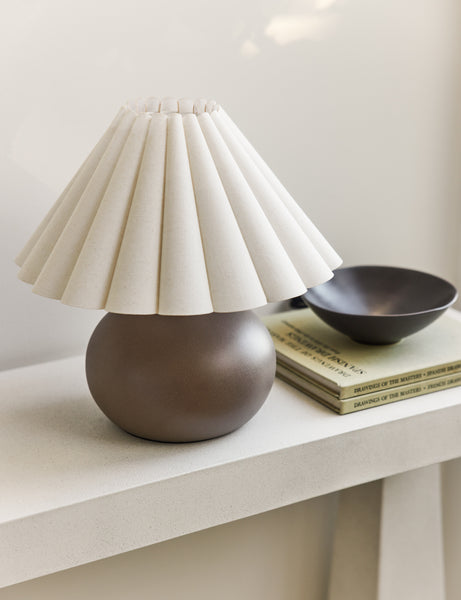 #size::mini #color::latte | Luis round ceramic mini table lamp styled on a white console table.