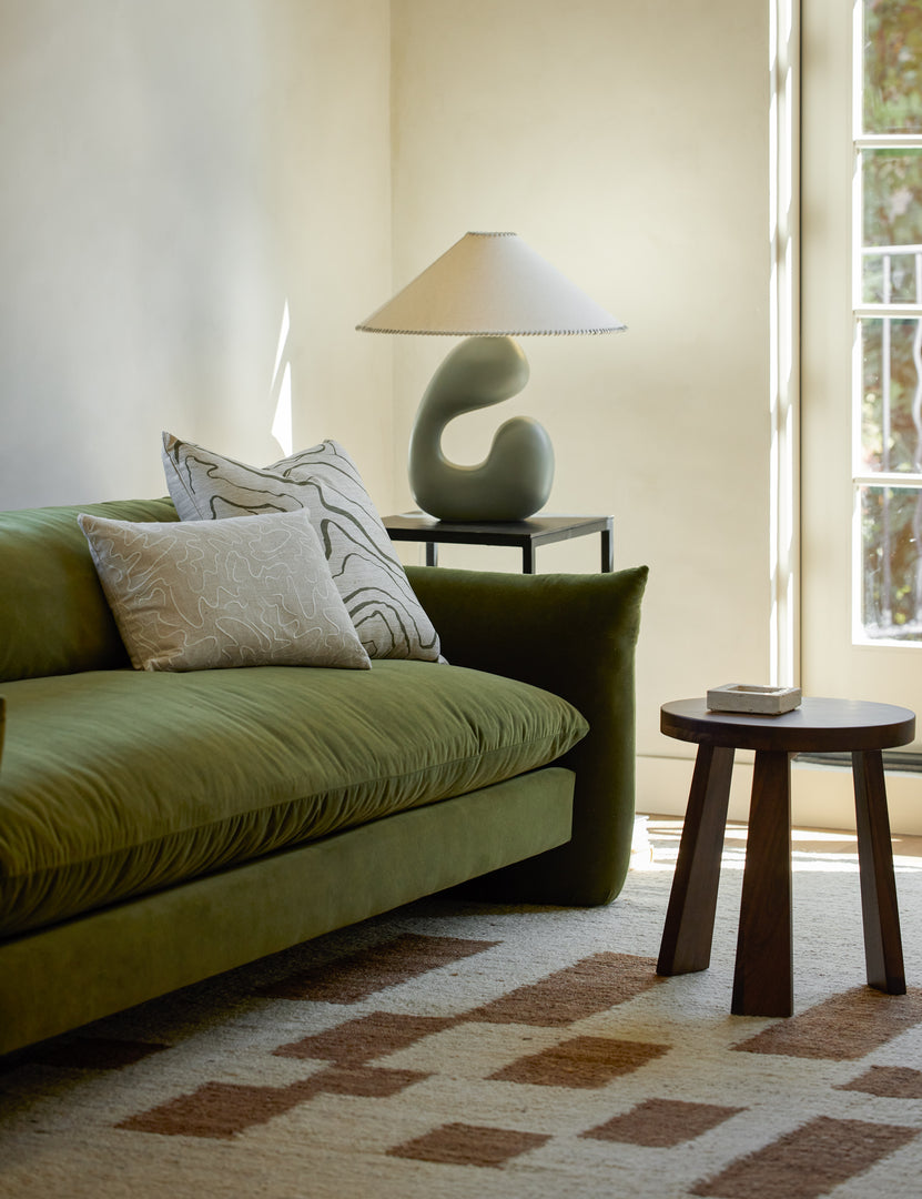 #color::sage | Saguaro Sculptural Ceramic Table Lamp by Elan Byrd styled on a side table next to a sofa.
