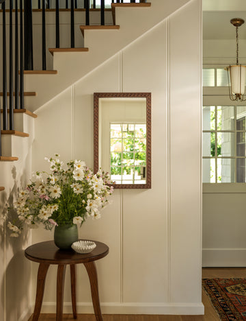 #color::olive | Campden matte green ceramic vase by Heidi Caillier styled on a round side table in an entryway.