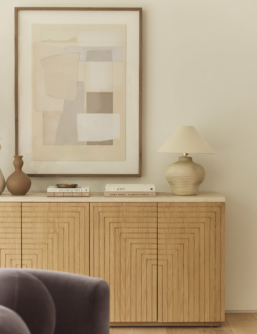 #color::ivory | Wrinkle ceramic table lamp by Sarah Sherman Samuel styled on a sideboard cabinet.