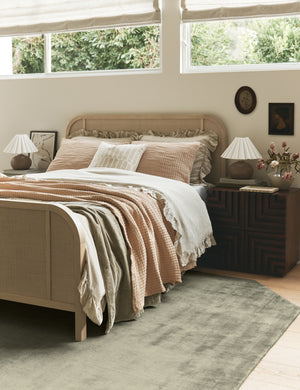 Bedroom featuring the Damara solid viscose rug in sage.