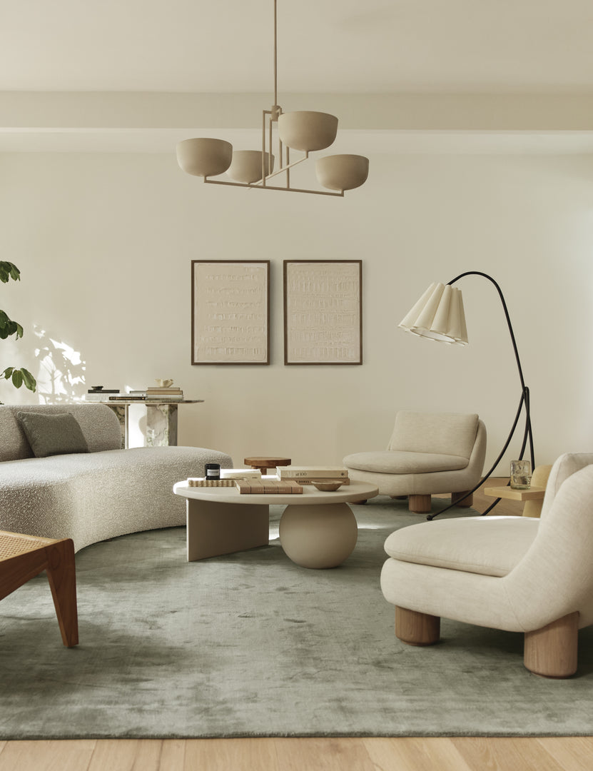 #color::ivory | Living room featuring the Lozano chunky low-profile armless accent chair.