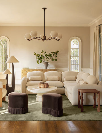 #color::chocolate #size::42.5-dia | Nara fluted glass 5-globe chandelier by Aimee Song hanging in a living room