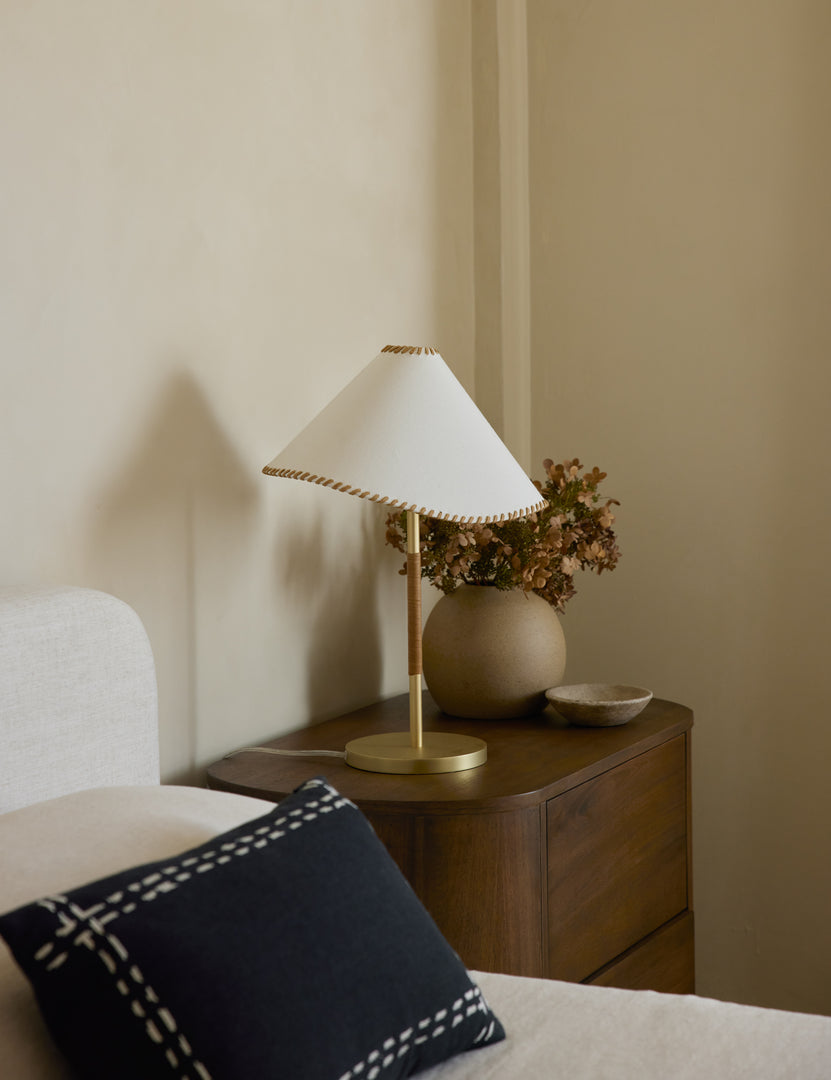 #color::brass | Arroyo Mixed-Material Table Lamp by Elan Byrd styled on a bedside table.