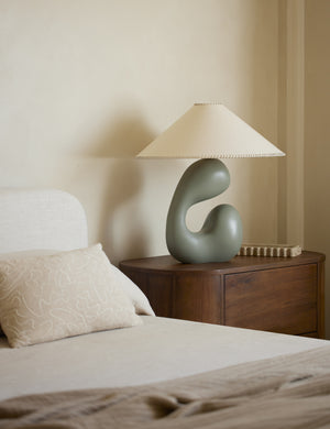 Saguaro Sculptural Ceramic Table Lamp by Elan Byrd styled on a bedside table.