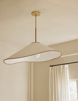 Arroyo Mixed-Material Pendant Light by Elan Byrd hanging from the ceiling.