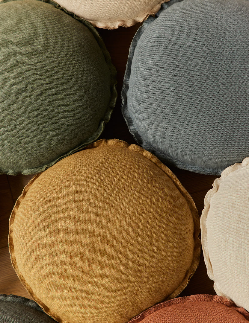 #color::marigold #color::olive #color::dusty-blue | Various colors of the Arlo linen flange trim round pillow together.