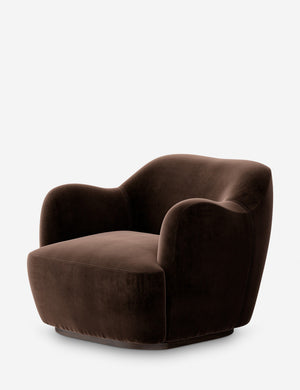 Angled view of the Selkie modern barrel swivel chair in brown velvet.