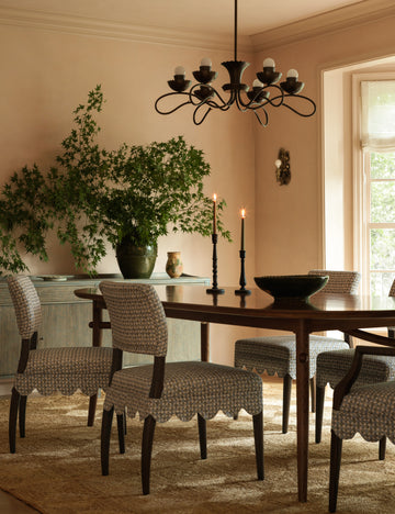 #color::burnished-brass #size::29-dia | Houghton six arm iron chandelier by Heidi Caillier hung over a dining table