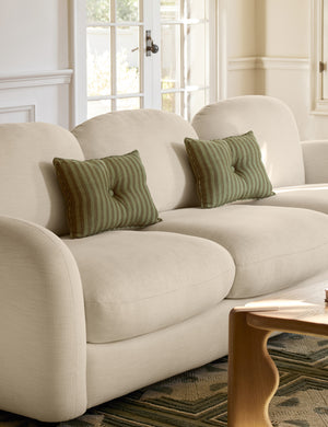 Welby striped tufted button linen throw pillow by Aimee Song styled on a sofa