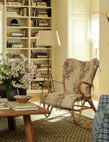#color::aged-brass | Francis slim frame tripod floor lamp by Heidi Caillier styled next to an accent chair