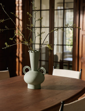 Idra tall round handle ceramic vase by Aimee Song styled on a dining room table