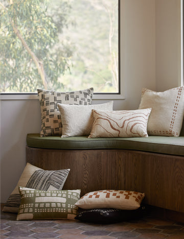 | Collection of throw pillows from designer Elan Byrd in various sizes and patterns.