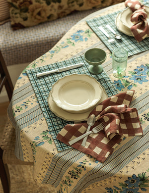 Dining table and place setting styled with the Golden floral stripe linen tablecloth by Heidi Caillier