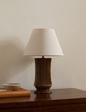 Alta fluted ceramic base table lamp by Heidi Caillier styled on a dresser