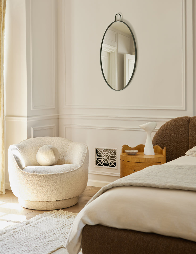 #color::teddy-boucle | Fern scalloped back boucle upholstered swivel chair styled in a corner of a bedroom