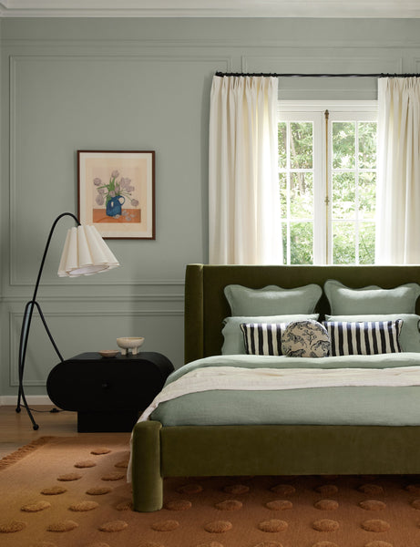 #color::bronze | Addie modern fluted shade floor lamp styled next to a nightstand in a bedroom