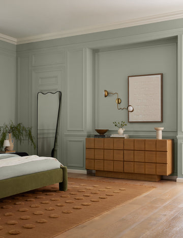 #showall::40270937358435 | Kukka modern wavy adjustable two arm wall sconce in brass hung above a dresser in a bedroom