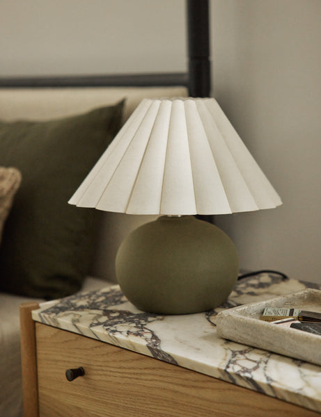 #size::mini #color::green | Luis round ceramic mini table lamp styled on a marble top nighstand.