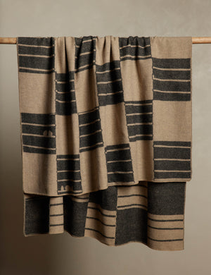 Checkered wool throw blanket in black and beige hanging