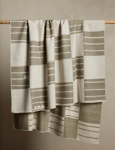 #color::ivory-and-olive | Checkered wool throw blanket in ivory and olive hanging