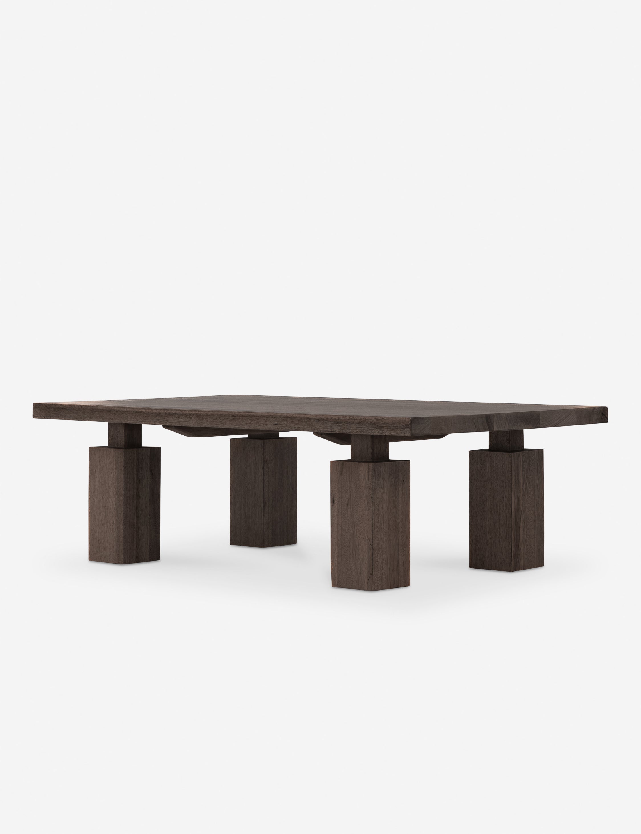 Close-up of the same coffee table showing wood grain and squared leg connection.